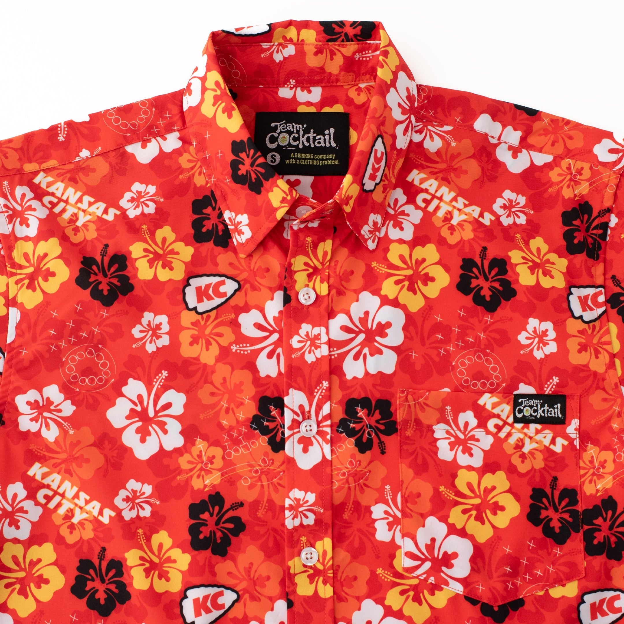 Red floral patterned shirt with 'Kansas City' text and logos on a white background