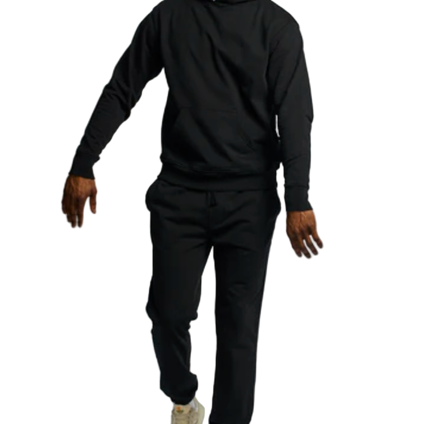 Person wearing a black hoodie and black pants on a white background