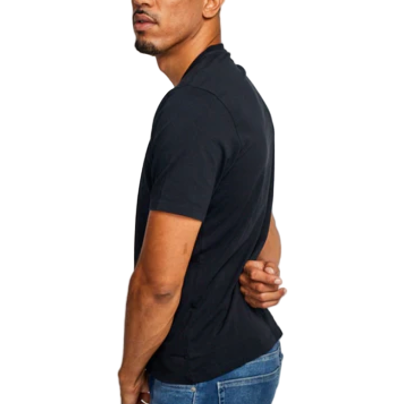 Man wearing a black t-shirt and blue jeans against a white background