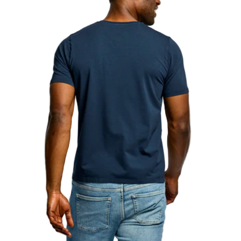 Person wearing a navy blue t-shirt and light blue jeans on a white background