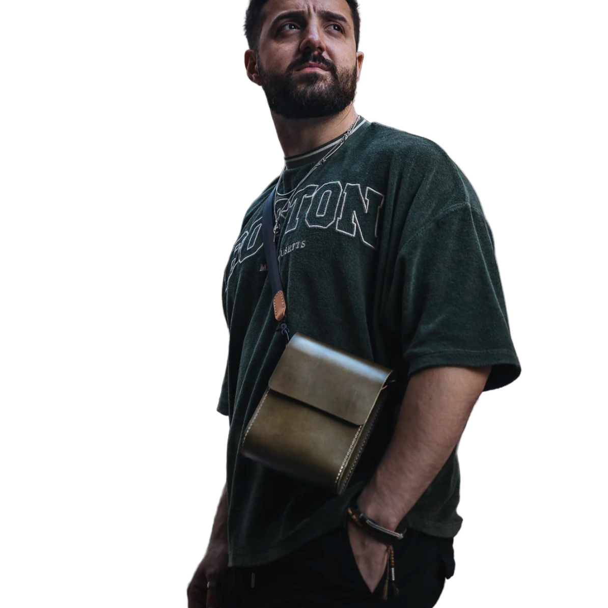 Man wearing a green t-shirt with 'Pittston' text, holding a green bag on a white background