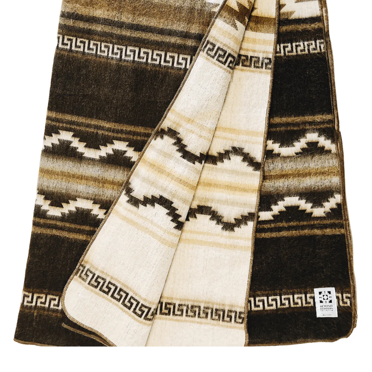 Woven blanket with geometric pattern on a white background