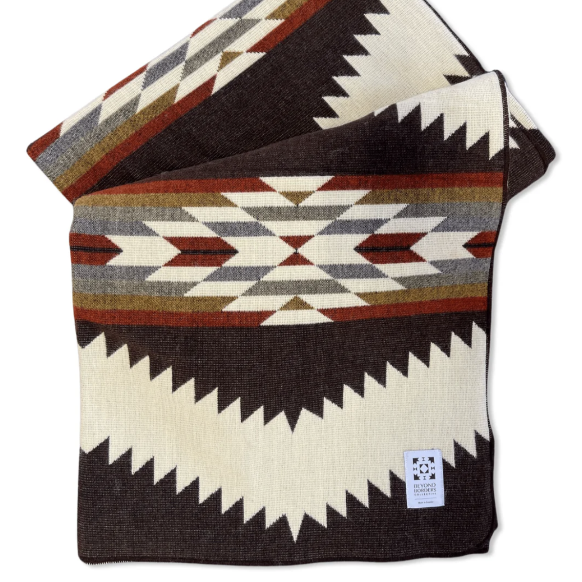 Woven blanket with geometric pattern on a white background