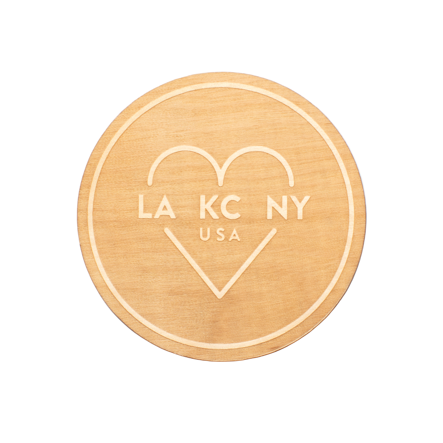 Gold circular coaster with 'LA KC NY USA' text on a white background