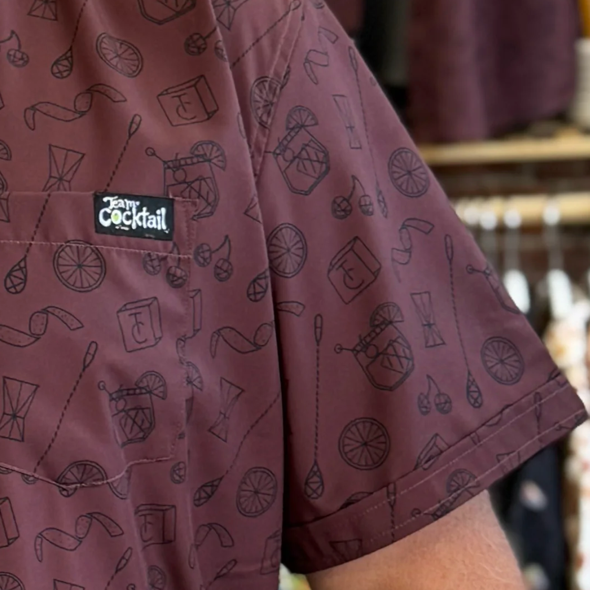 Maroon shirt with cocktail-themed pattern and Patagonia logo.