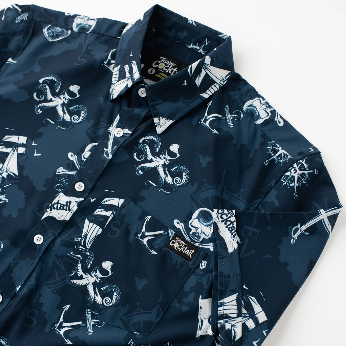 Navy blue shirt with white nautical pattern on a white background