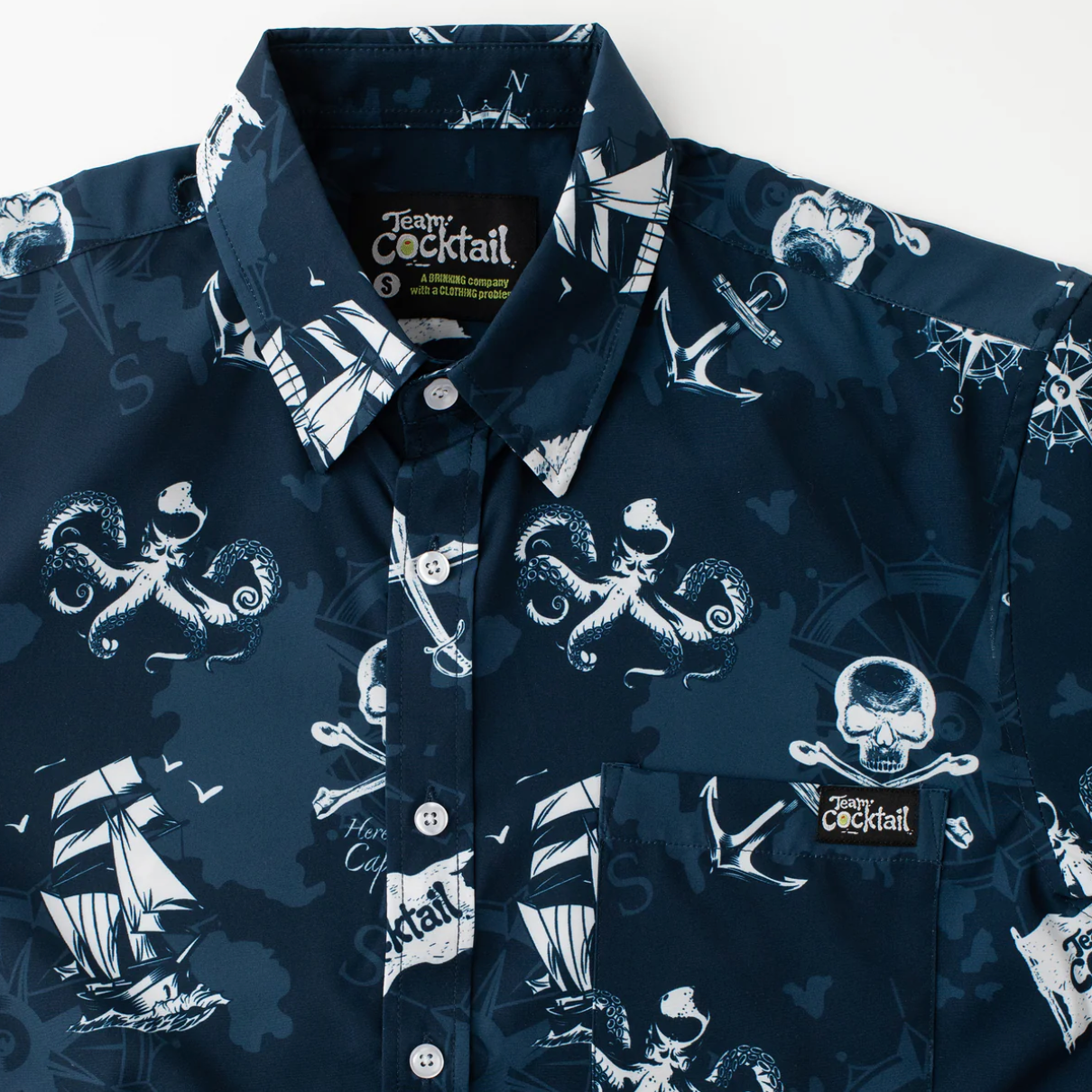 Navy blue shirt with white nautical-themed print on a white background