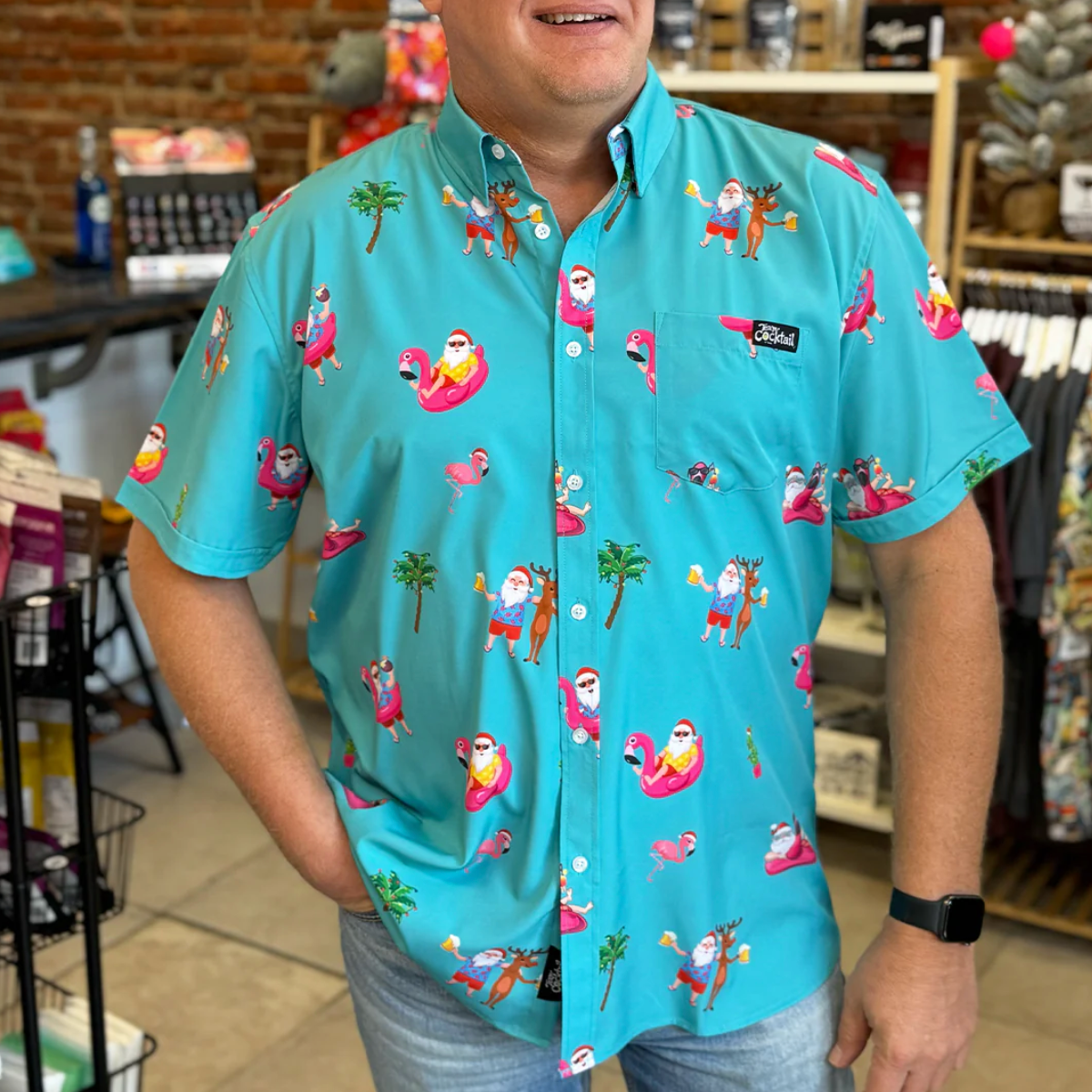 Man wearing a colorful shirt with cartoon characters in a store setting