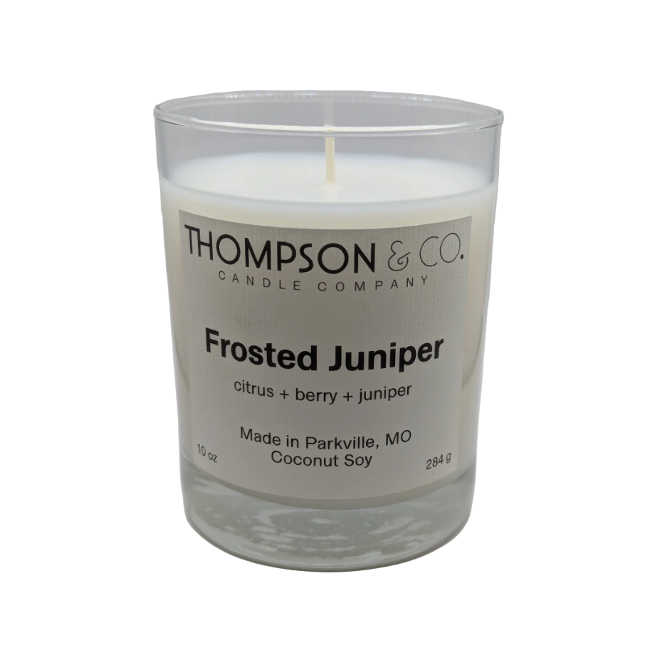 Thompson & Co candle with 'Frosted Juniper' scent on a white background