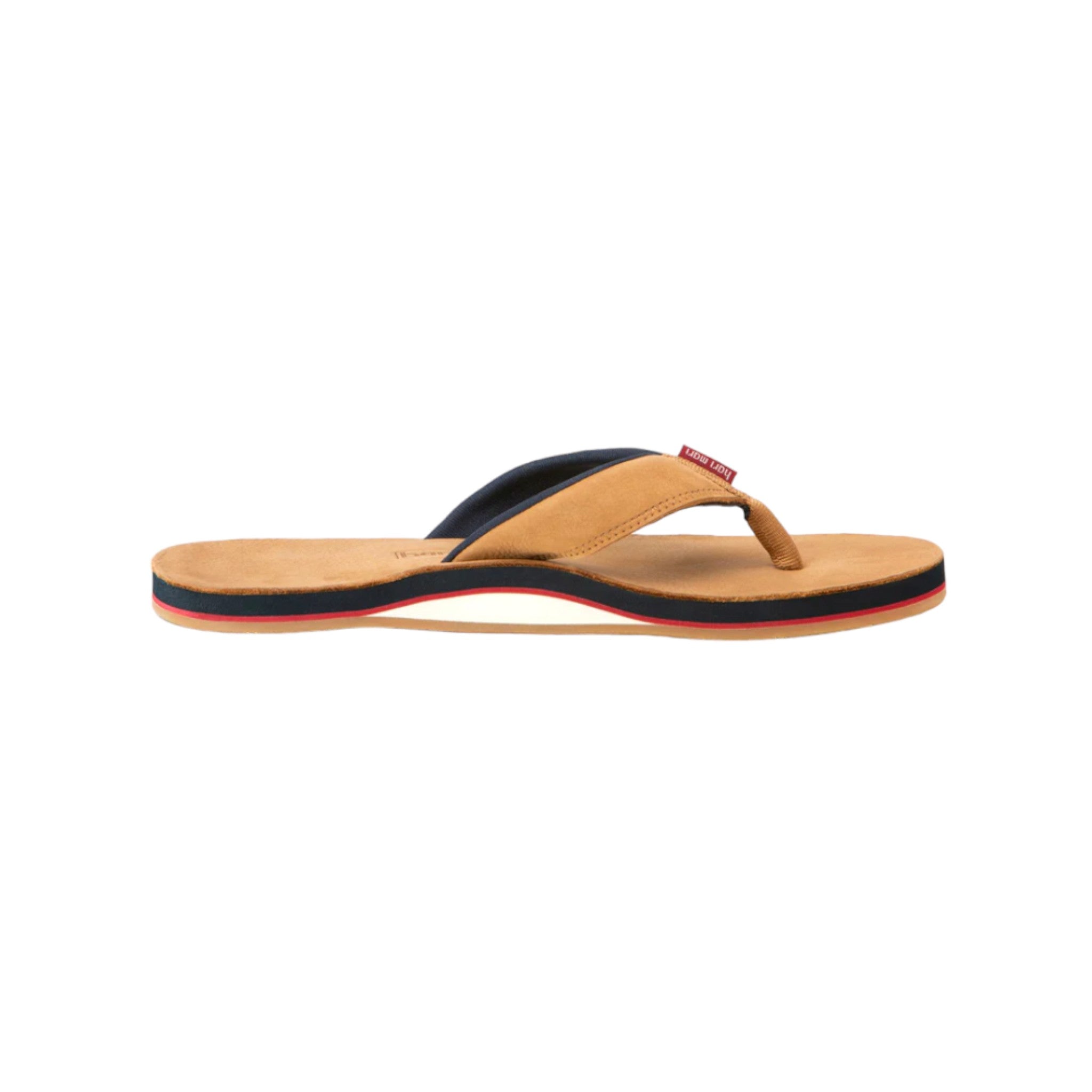 side profile of a tan flip flop with navy, red, and white accents