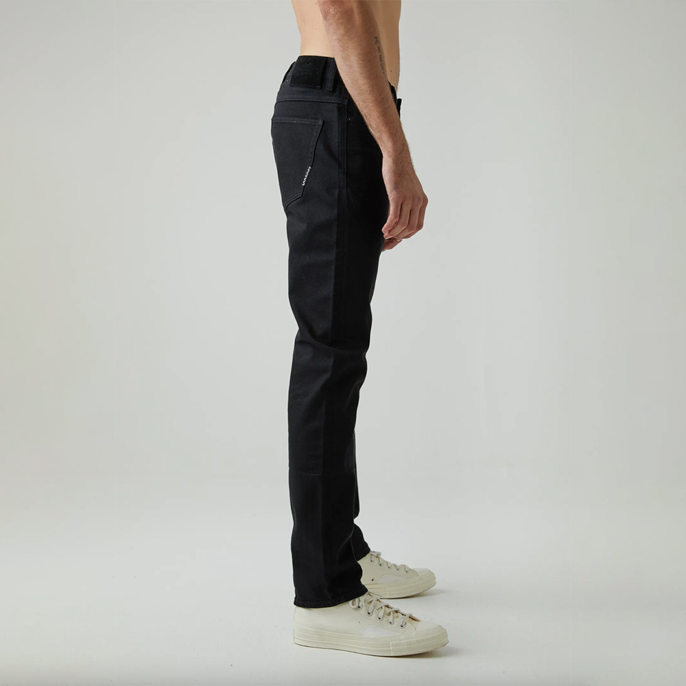 Dark wash fitted denim with button and zip closure