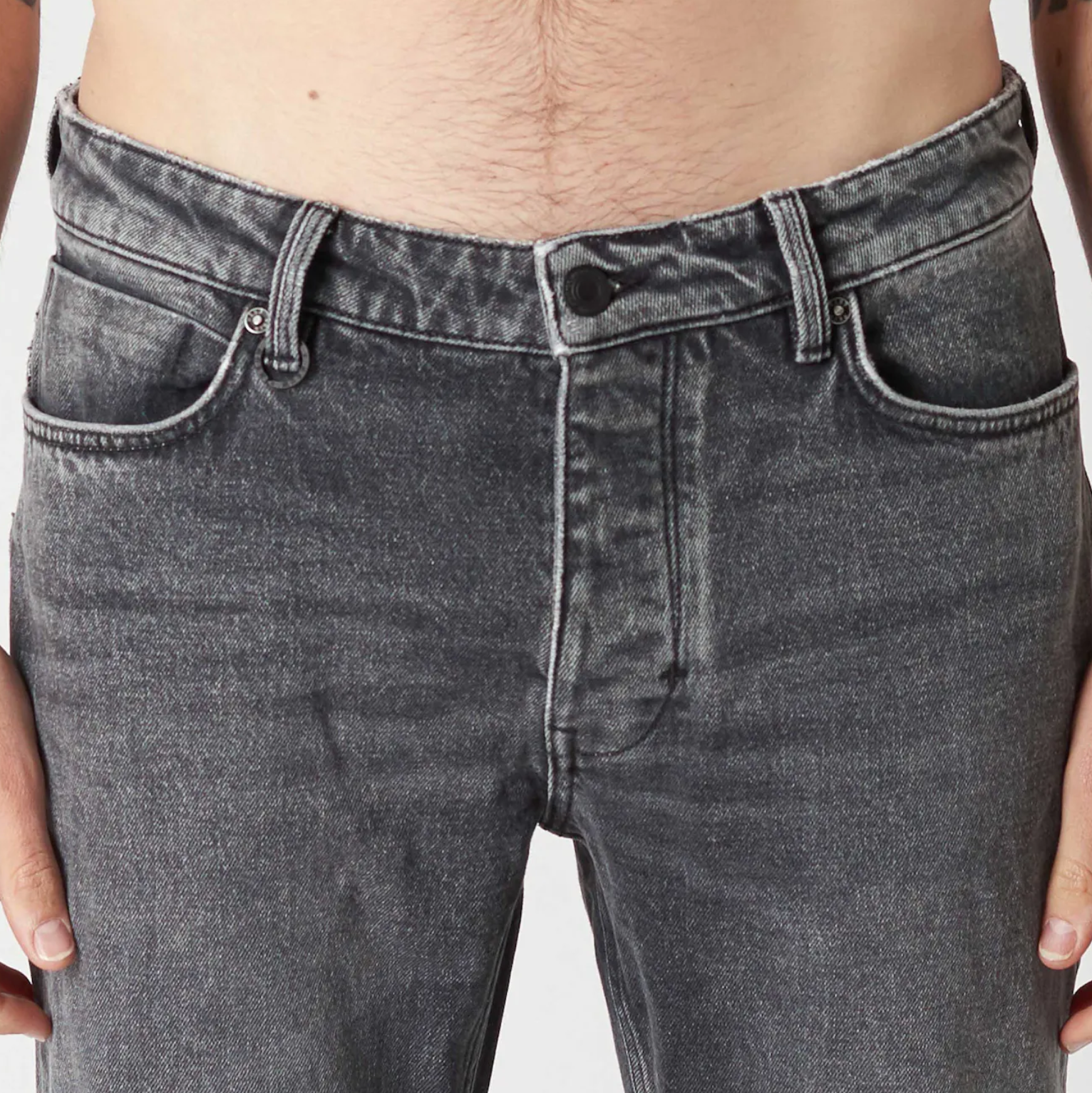 Dark wash fitted denim with button and zip closure