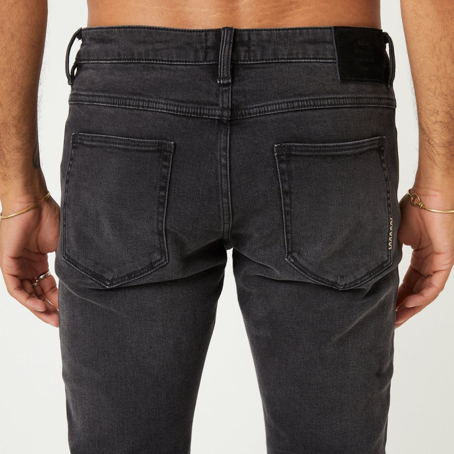 Dark slim fitting denim with button and zip closure