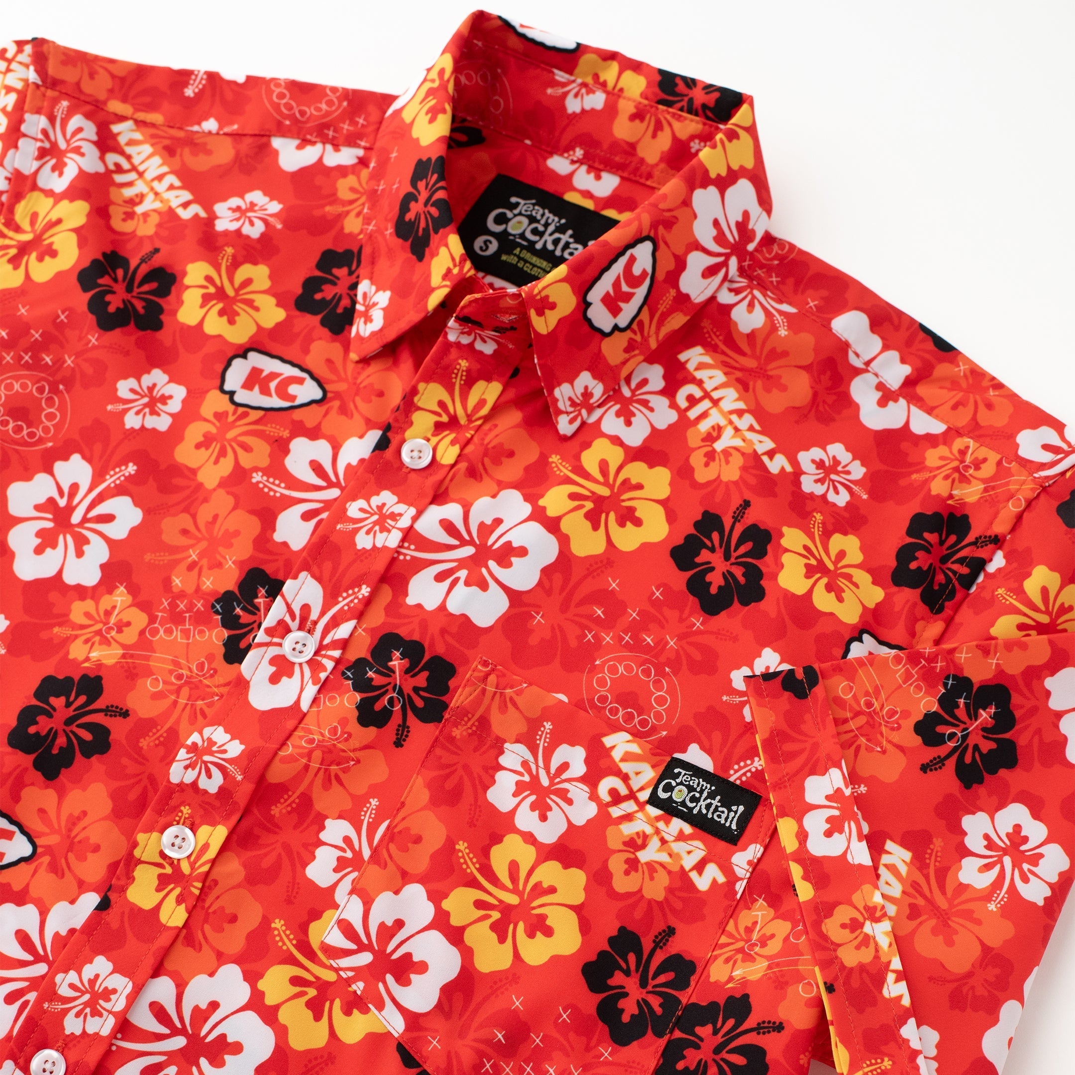 Red floral patterned shirt with 'Cockatoo' branding on a white background