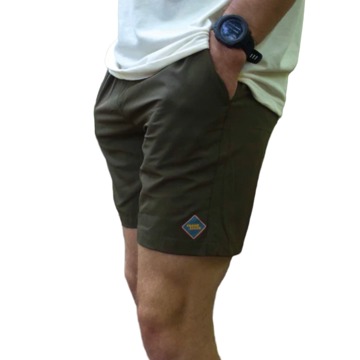 Person wearing green shorts with a brand logo, standing outdoors with a white background