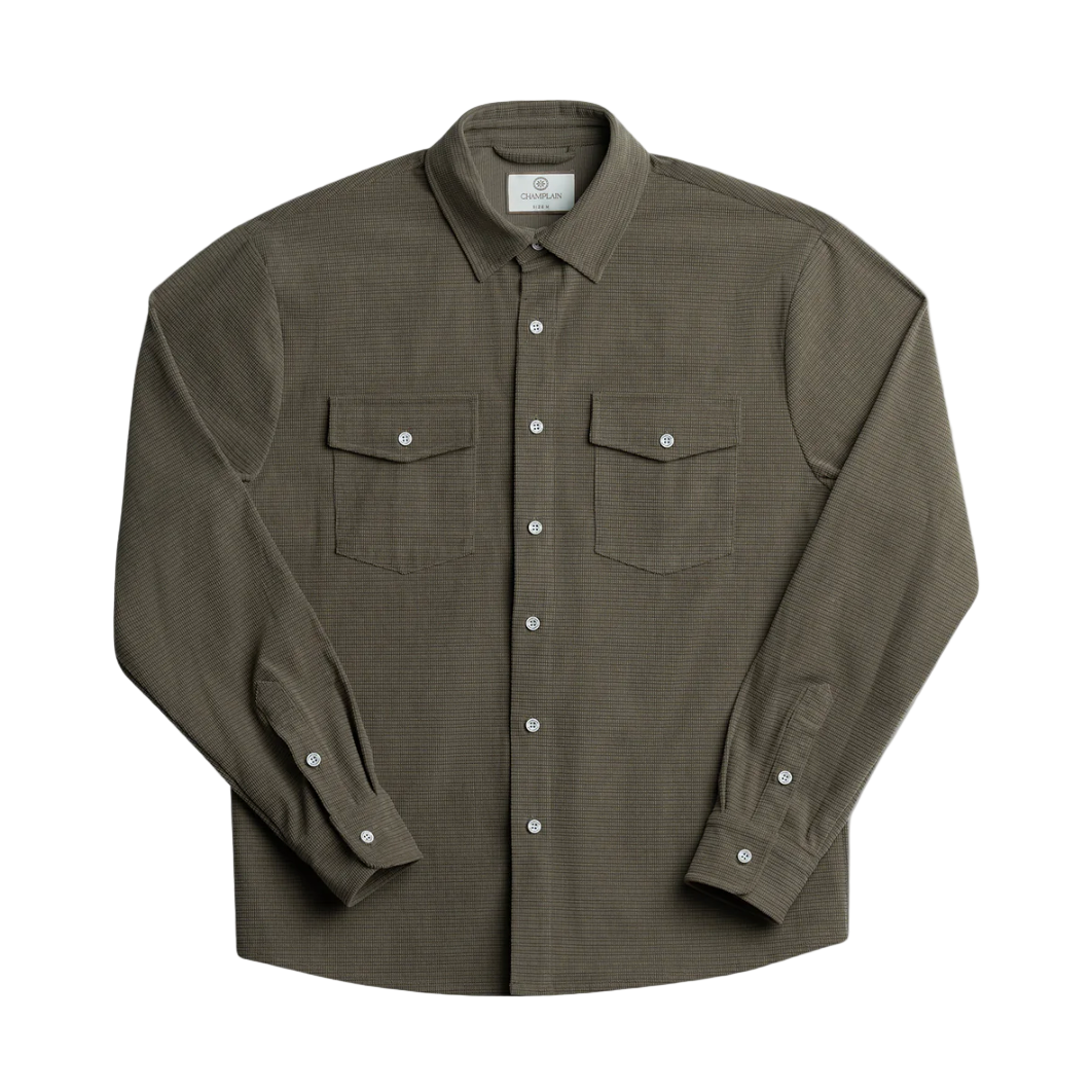 Green button-up shirt with two chest pockets on a white background