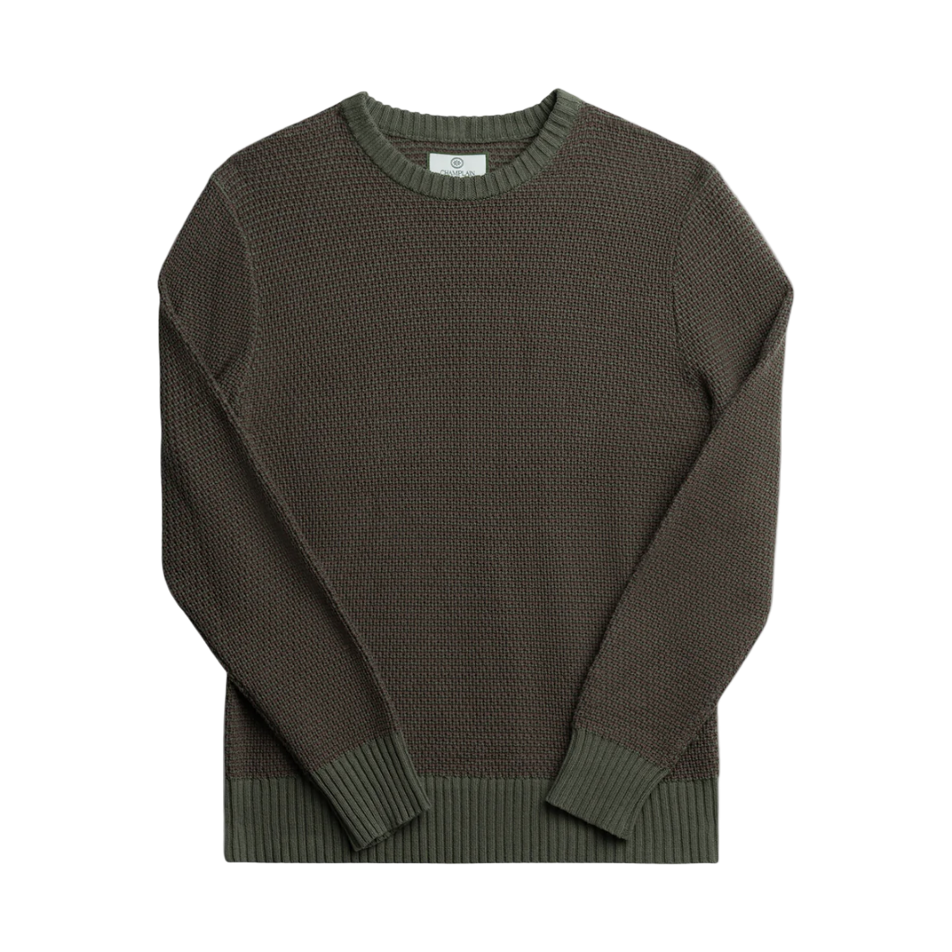 Green sweater on a white background