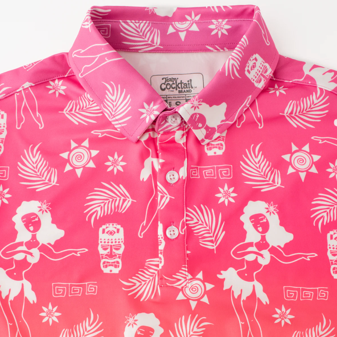 Pink shirt with white hula dancer and tropical pattern on a white background