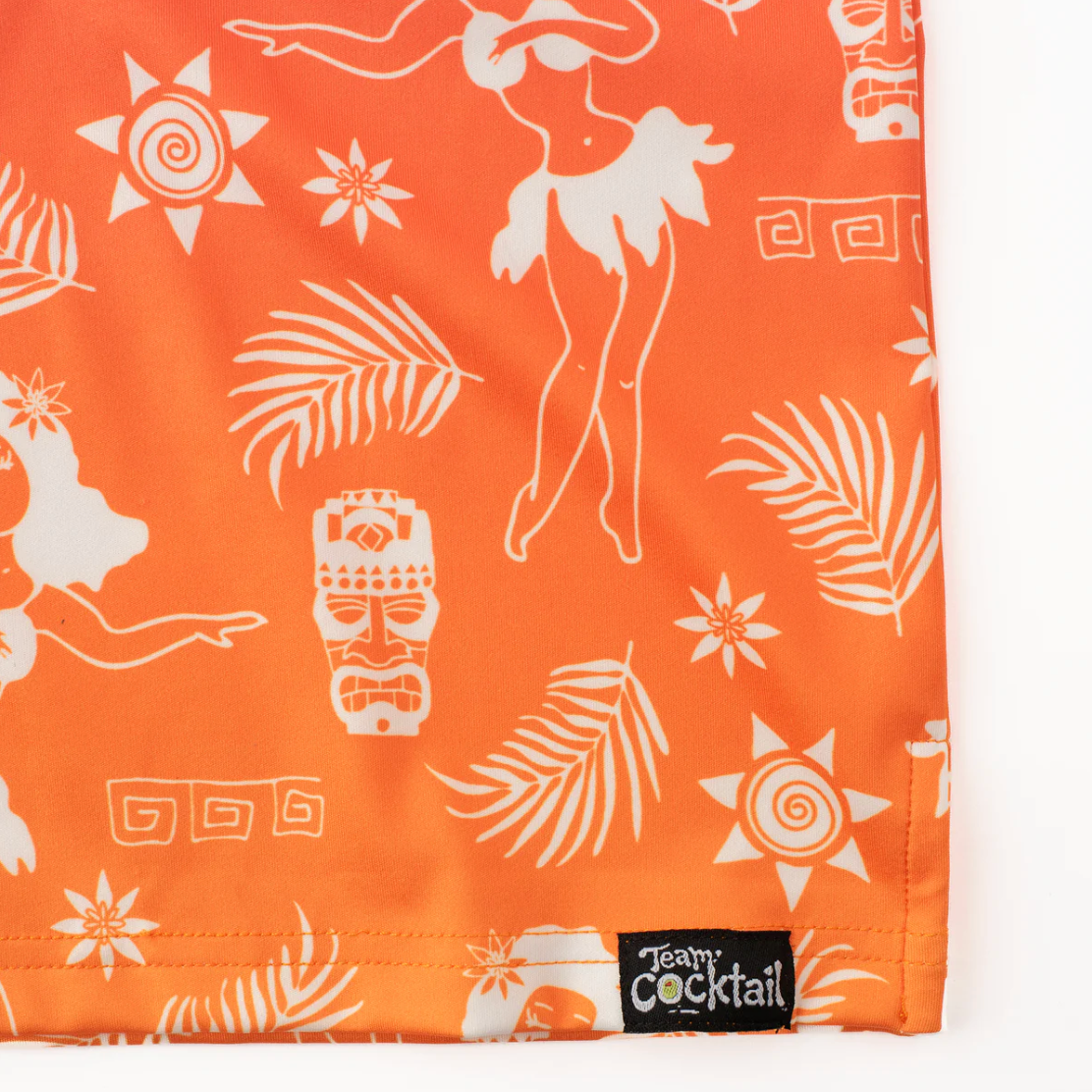 Orange fabric with white tiki and leaf pattern, featuring a 'Teamy Cocktail' label.