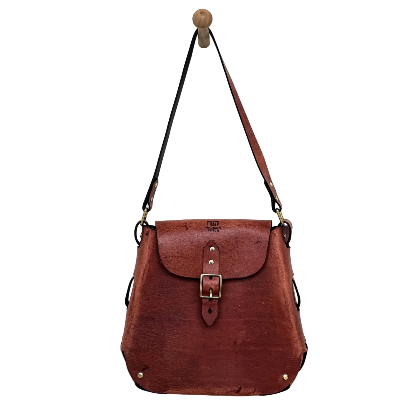 Brown leather bag with a buckle on a white background
