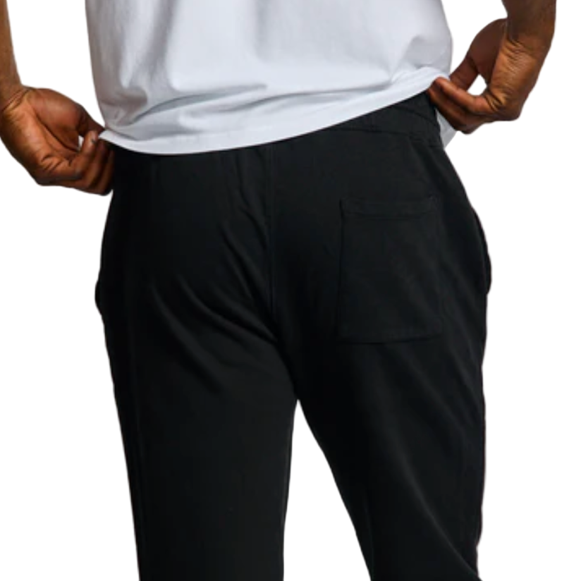 Person wearing black pants and a white shirt on a white background