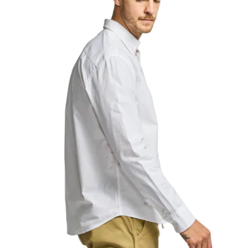Man wearing a white shirt and beige pants on a white background