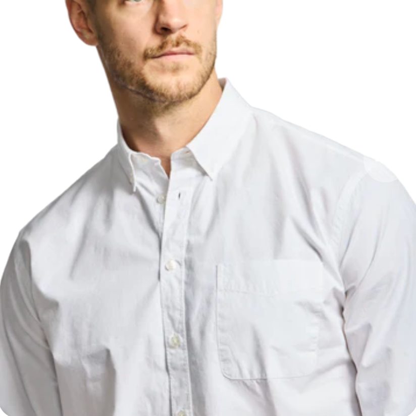 Man wearing a white dress shirt against a white background