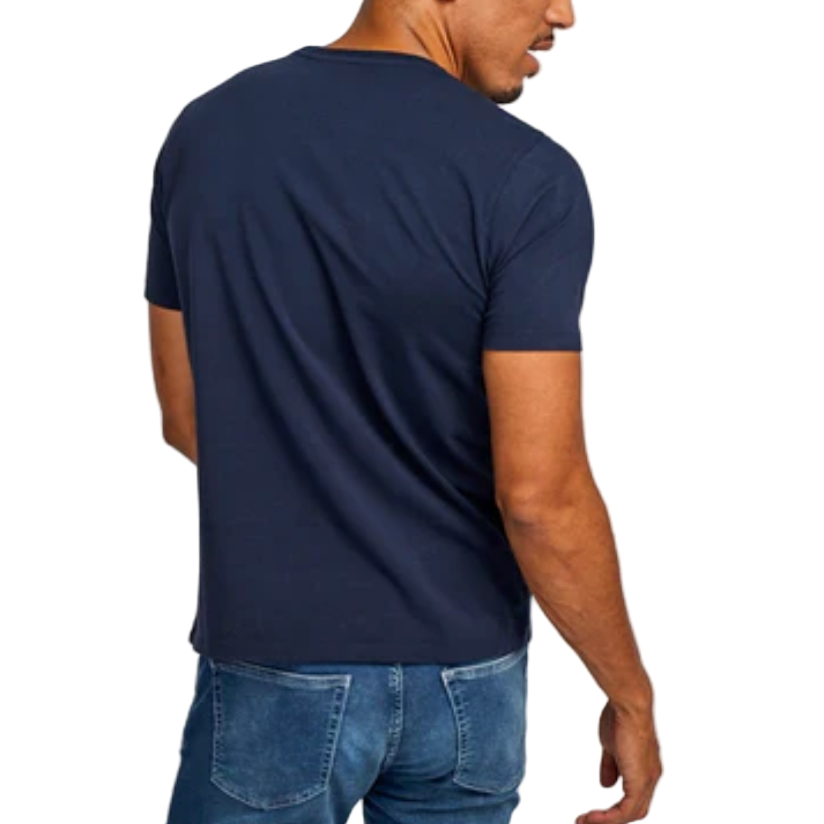 Man wearing a navy blue t-shirt and jeans on a  backgroundhite