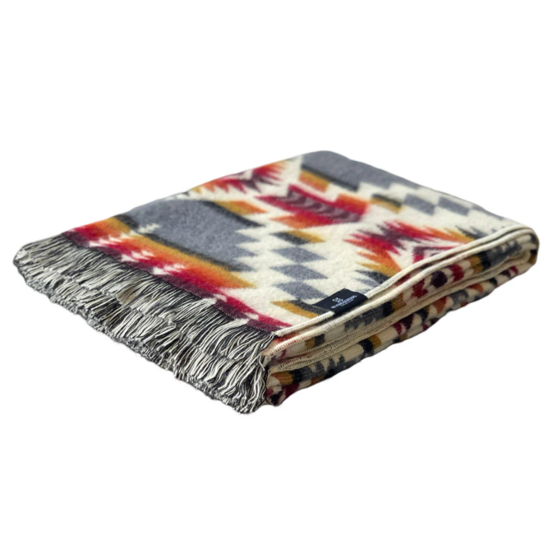 Plaid blanket with fringes on a white background