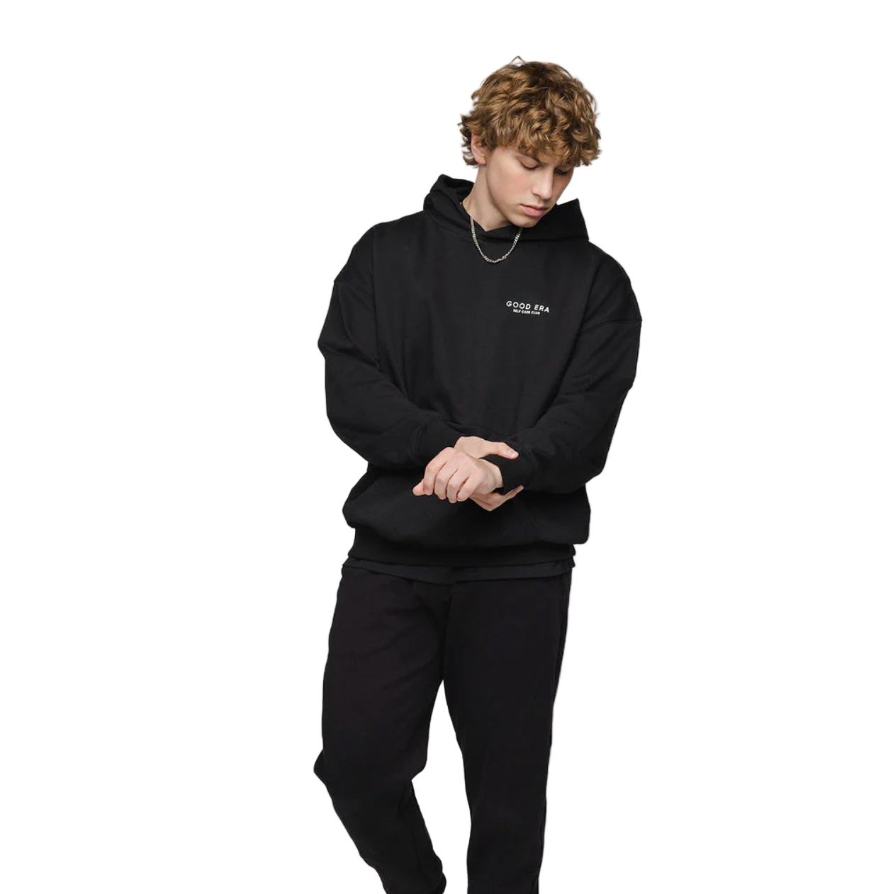 Person wearing a black hoodie with a logo on a white background