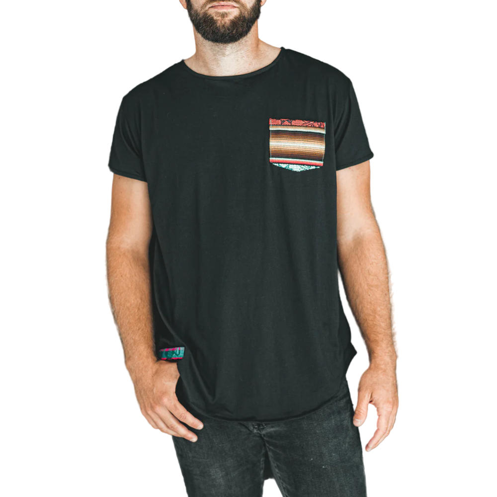 Man wearing a black t-shirt with a colorful pocket design against a white background