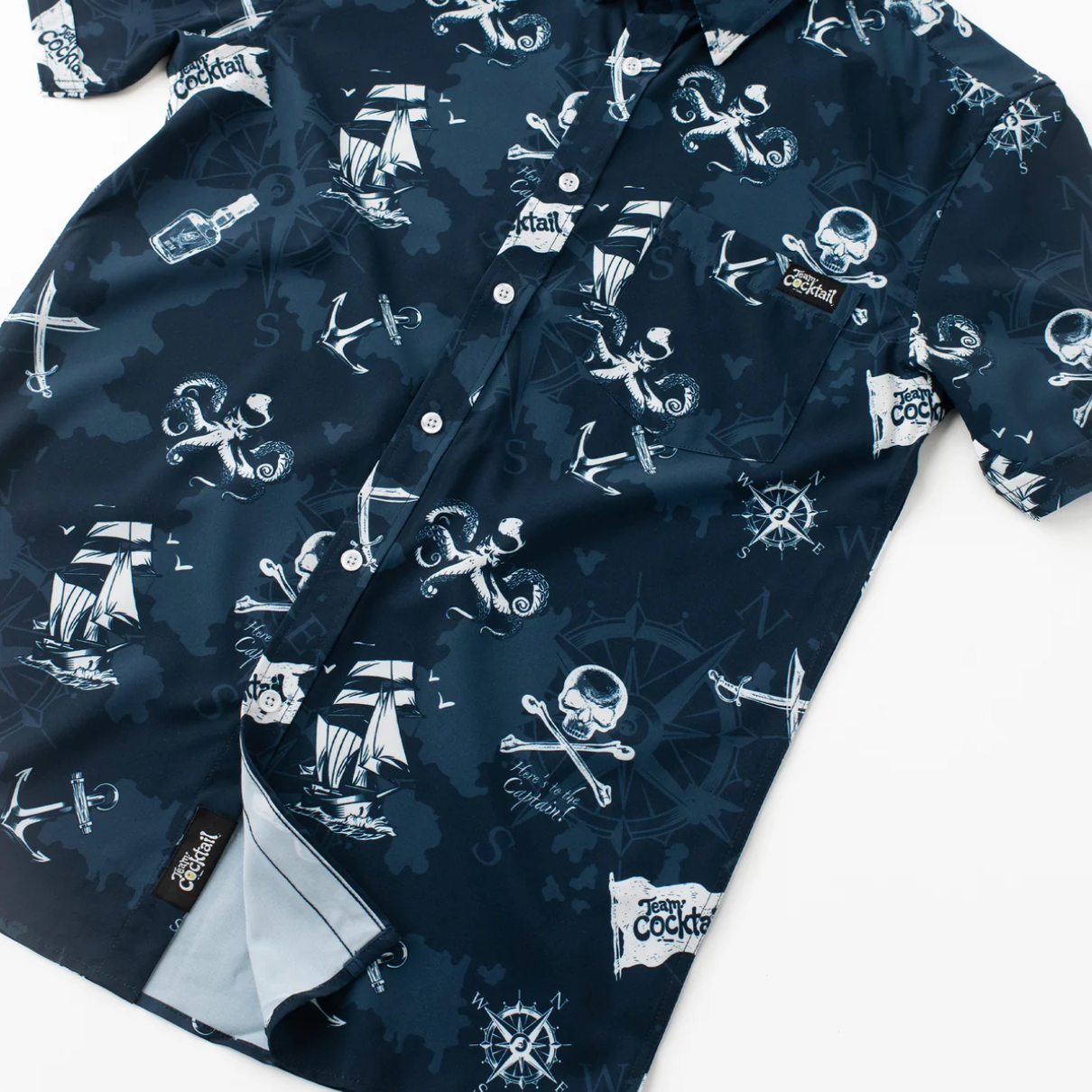 Navy blue shirt with white nautical pattern on a white background