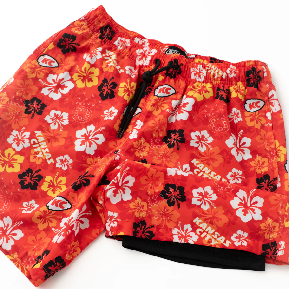 Red shorts with floral pattern and 'Kansas City' text on a white background