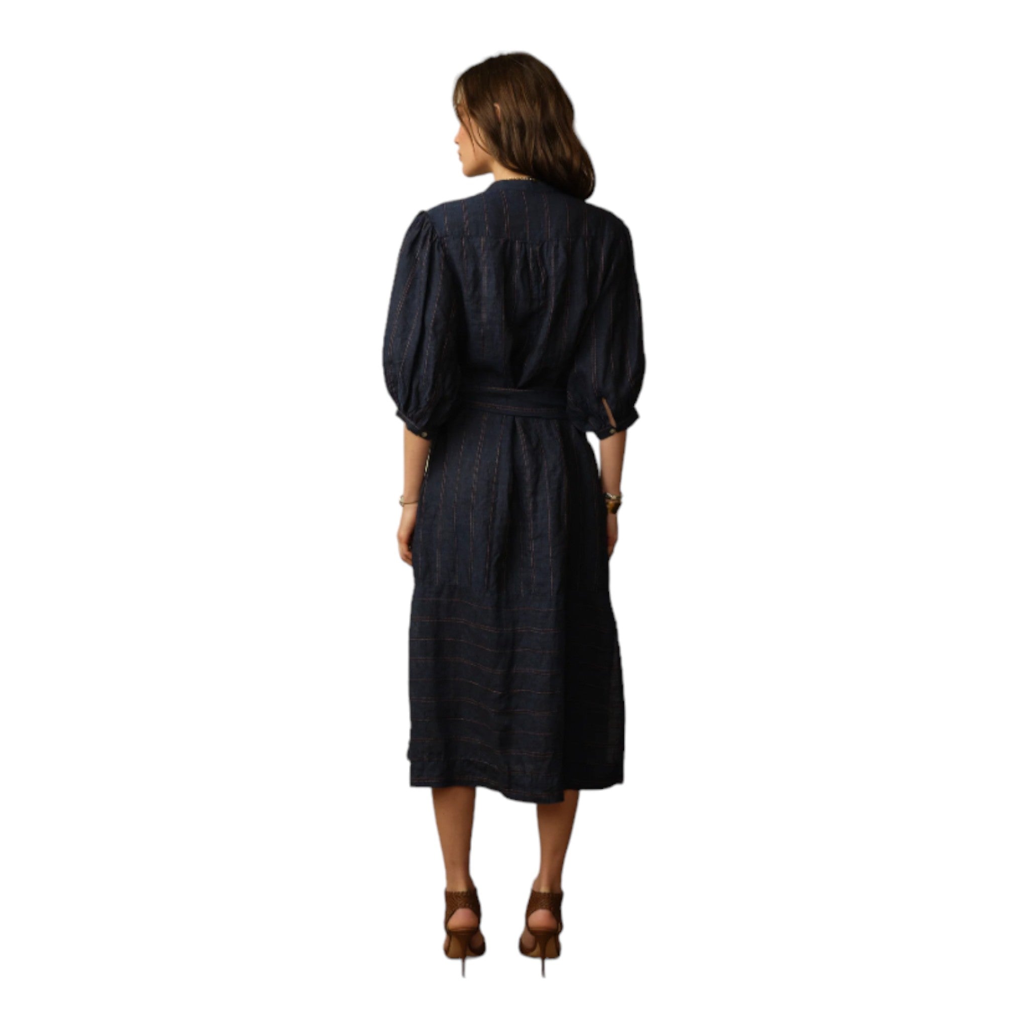 dark denim colored midi linen dress with a v neck, waist tie, 3 quarter puff sleeve and a vertical brown stripe detail