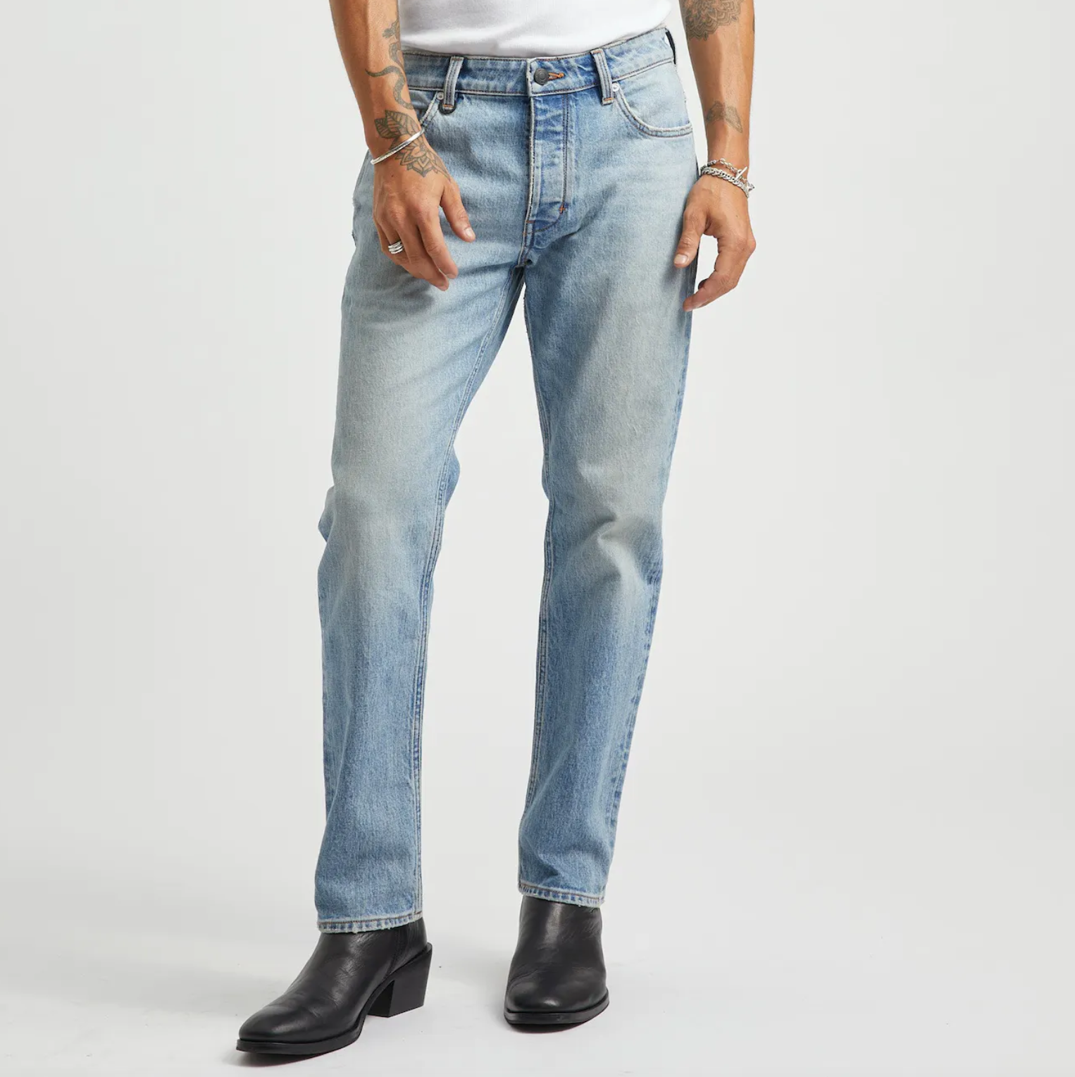 Light wash slim fit denim with button and zip closure