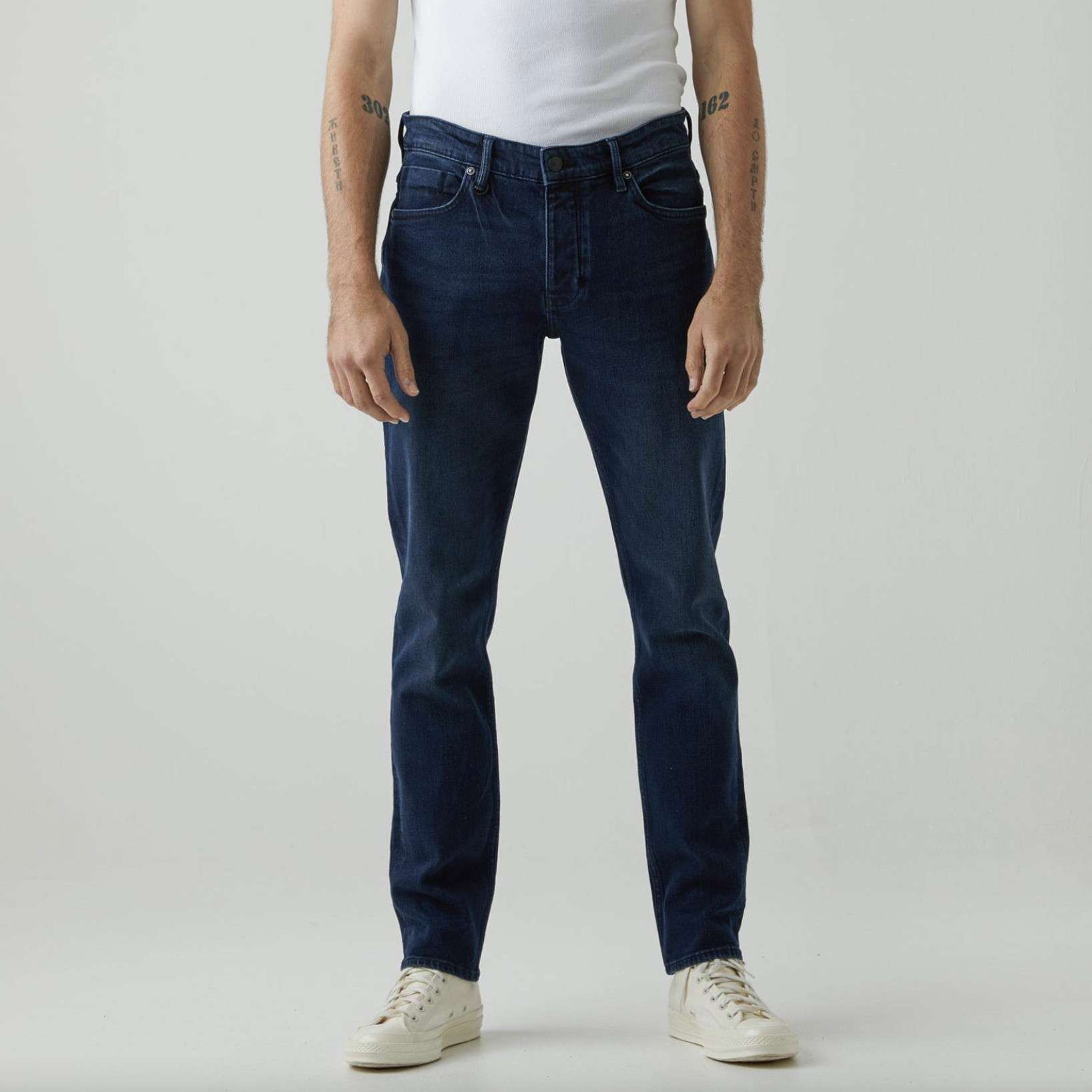 Dark wash denim with button and zip closure